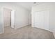This bedroom features tiled flooring and a closet for storage at 11165 Balfour St, Venice, FL 34293