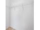 Empty closet featuring shelving, neutral walls and trim, and light tile flooring for a simple design at 11165 Balfour St, Venice, FL 34293