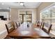 Inviting dining area with a rustic wooden table, perfect for entertaining guests with a bright window view at 13040 Quigley Ave, Weeki Wachee, FL 34614