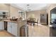 Bright kitchen with granite counters, stainless steel appliances, and a dining area perfect for Gathering meals at 13040 Quigley Ave, Weeki Wachee, FL 34614