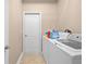 Functional laundry room with a washer, dryer, and storage solutions at 13040 Quigley Ave, Weeki Wachee, FL 34614