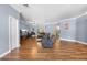 Spacious living room with hardwood floors provides ample room for seating and relaxation at 13040 Quigley Ave, Weeki Wachee, FL 34614