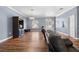Large living room featuring beautiful wood floors, neutral blue walls, and comfortable seating at 13040 Quigley Ave, Weeki Wachee, FL 34614