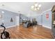 Spacious living room with wood floors, comfortable seating, and great natural light at 13040 Quigley Ave, Weeki Wachee, FL 34614