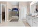 Updated bathroom featuring a tub, tiled shower, modern fixtures, and ample space at 13040 Quigley Ave, Weeki Wachee, FL 34614