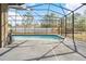 Screened-in pool area with ample space for lounge furniture at 13040 Quigley Ave, Weeki Wachee, FL 34614