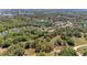 An aerial shot of the property shows its location surrounded by lush green trees and a beautiful neighborhood at 14530 17Th E Ave, Bradenton, FL 34212