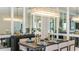 Elegant dining room with a stylish chandelier, seating for six, and sophisticated decor, perfect for formal meals at 14919 Contenta Loop, Bradenton, FL 34211