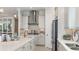Modern kitchen with stainless steel appliances, granite countertops, and elegant pendant lighting at 14919 Contenta Loop, Bradenton, FL 34211