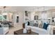 Open-concept living space with a modern kitchen, dining area, and comfortable seating, perfect for entertaining guests at 14919 Contenta Loop, Bradenton, FL 34211