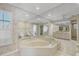 Large bathroom has a garden tub, shower, and ample mirror space at 1511 Waterford Dr, Venice, FL 34292