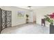Bright bedroom with decorative screen features tile flooring and view of outdoor patio at 1511 Waterford Dr, Venice, FL 34292