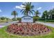 Waterford: A Championship Golf and Tennis Community entrance sign surrounded by vibrant landscaping at 1511 Waterford Dr, Venice, FL 34292