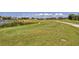 Scenic golf course view with lush green fairways and mature trees in a residential community at 1511 Waterford Dr, Venice, FL 34292
