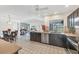 Open concept kitchen with modern appliances, breakfast bar, and seamless flow to the living area at 1511 Waterford Dr, Venice, FL 34292