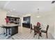 Modern kitchen featuring sleek dark cabinetry, stainless steel appliances, and ample counter space at 1511 Waterford Dr, Venice, FL 34292