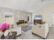Cozy living room featuring a stone accent wall, fireplace, and comfortable seating at 1511 Waterford Dr, Venice, FL 34292
