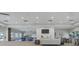Spacious lounge with modern décor, comfortable seating, and ample natural light at 1511 Waterford Dr, Venice, FL 34292