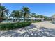 Beautiful pool area with a lifeguard station, a tennis court, and lounge chairs at 1511 Waterford Dr, Venice, FL 34292