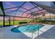 Relaxing screened-in pool area perfect for enjoying outdoor living and entertaining at 1511 Waterford Dr, Venice, FL 34292