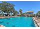 Inviting swimming pool surrounded by lush landscaping and comfortable lounge chairs at 1511 Waterford Dr, Venice, FL 34292