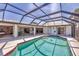Relaxing pool area with access to multiple rooms and a screened enclosure overlooking the backyard at 1511 Waterford Dr, Venice, FL 34292