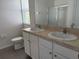 Bathroom featuring double sinks, vanity with white cabinets, and a shower at 15517 Rose Grove Dr, Bradenton, FL 34212
