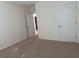 A bright bedroom features neutral carpeting and light-colored walls at 15517 Rose Grove Dr, Bradenton, FL 34212