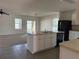 Bright kitchen with an island, stainless steel sink, and black appliances at 15517 Rose Grove Dr, Bradenton, FL 34212