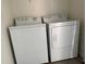 Laundry room with a white washer and dryer at 15517 Rose Grove Dr, Bradenton, FL 34212
