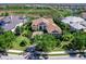 Beautiful home with a circular driveway, a two-car garage and an expansive green yard that is well-manicured at 16407 Daysailor Trl, Lakewood Ranch, FL 34202