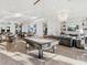 Spacious clubhouse featuring a pool table, comfortable seating, and elegant decor at 16407 Daysailor Trl, Lakewood Ranch, FL 34202