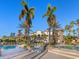 Luxurious community pool and clubhouse with elegant architecture and tropical landscaping at 16407 Daysailor Trl, Lakewood Ranch, FL 34202
