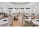 Elegantly appointed clubhouse dining room featuring tables set with crisp linens and stylish decor at 16407 Daysailor Trl, Lakewood Ranch, FL 34202