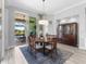 Bright dining room with natural light and a traditional wooden hutch at 16407 Daysailor Trl, Lakewood Ranch, FL 34202