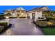 Beautiful paved driveway leading to a three-car garage of a well-maintained one-story home at 16407 Daysailor Trl, Lakewood Ranch, FL 34202
