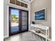 Inviting foyer with stylish flooring, modern console table, and elegant decor at 16407 Daysailor Trl, Lakewood Ranch, FL 34202