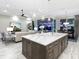 Bright kitchen island, with a view of the living room and dining area that opens to the lanai at 16407 Daysailor Trl, Lakewood Ranch, FL 34202