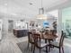 Open-concept living space with a spacious kitchen, dining area, and modern living room at 16407 Daysailor Trl, Lakewood Ranch, FL 34202