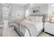 Serene main bedroom featuring soft colors, a cozy bed, and ample natural light at 16407 Daysailor Trl, Lakewood Ranch, FL 34202