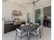 Outdoor kitchen with grill and adjacent dining area ideal for entertaining and relaxation at 16407 Daysailor Trl, Lakewood Ranch, FL 34202
