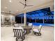 Covered patio with neutral furniture, ceiling fan, and a view of the in-ground pool and spa at 16407 Daysailor Trl, Lakewood Ranch, FL 34202