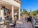 Outdoor patio area featuring covered seating with decorative columns and lush landscaping at 16407 Daysailor Trl, Lakewood Ranch, FL 34202