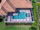 Aerial view of an inviting rectangular pool and spa with a screened-in enclosure and manicured backyard landscaping at 16407 Daysailor Trl, Lakewood Ranch, FL 34202