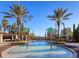 Resort-style community pool featuring palm trees, fountains, and comfortable lounge seating at 16407 Daysailor Trl, Lakewood Ranch, FL 34202