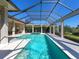 Relaxing screened in pool and spa with views of the well maintained backyard at 16407 Daysailor Trl, Lakewood Ranch, FL 34202
