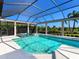 Sparkling screened in pool and spa surrounded by lush landscaping offers outdoor enjoyment at 16407 Daysailor Trl, Lakewood Ranch, FL 34202