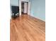 Bedroom with wood floors and connected bathroom offers convenience and classic style at 1862 Orangewood Ln, Sarasota, FL 34232