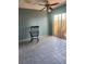 Spacious bonus room with ceiling fan and sliding glass door to patio, chair included at 1862 Orangewood Ln, Sarasota, FL 34232