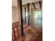 Open living space featuring unique architectural details, tile flooring, and natural light at 1862 Orangewood Ln, Sarasota, FL 34232